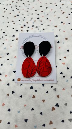 Handmade red and black pattern polymer clay statement earrings. All of my earrings are made out of polymer clay and using 925 sterling silver findings. My polymer clay earrings are handmade in United Kingdom; Please bear in mind that the earrings that you will receive may differ slightly from the image and there may be minor imperfections in each piece. That is why you are going to receive and have a modern, different and unique pair of earrings! Colours on computers monitors and screens may vary; so if you have any questions about these earrings, please send me a message prior to purchase and I will be honoured to give you the most detailed description I can. All the items will be posted in a large letter box and send via Royal Mail 1st Class; and if you order comes from UK it will be fre Hand Painted Red Polymer Clay Earrings, Red Hand Painted Polymer Clay Earrings, Handmade Red Polymer Clay Earrings, Red Drop Earrings In Polymer Clay, Red Polymer Clay Dangle Jewelry, Red Polymer Clay Drop Earrings, Trendy Red Hand Painted Earrings, Elegant Red Polymer Clay Earrings, Everyday Red Polymer Clay Jewelry