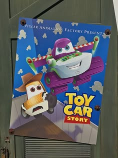 a toy car story poster hanging on the side of a building