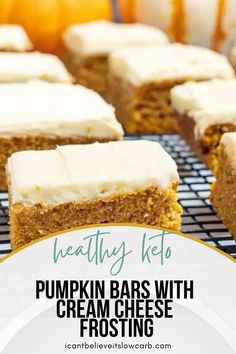 pumpkin bars with cream cheese frosting are on a cooling rack and there is text overlay reading healthy keto pumpkin bars with cream cheese frosting