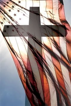 an american flag with a cross on it