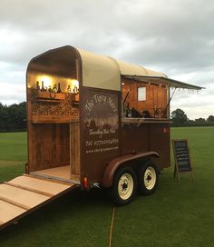 the food truck is parked on the grass