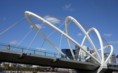 a large white bridge over a body of water