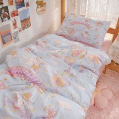 a child's bedroom with pink carpet and pictures on the wall behind the bed