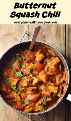 butternut squash chilli in a pan with spoons on the side and text overlay