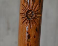 a wooden stick with an intricate design on it