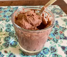 a glass cup filled with chocolate ice cream