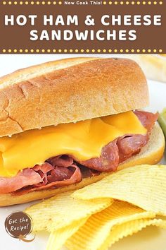 a sandwich with ham and cheese on it next to potato chips