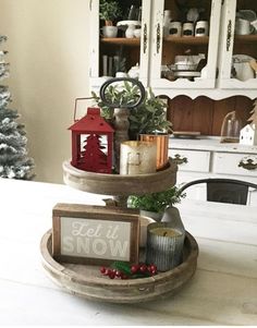 two wooden trays with christmas decorations on them