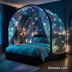 a bedroom with a bed covered in blue sheets and stars on the walls, along with a night sky theme