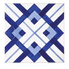 a blue and white tile with squares on it