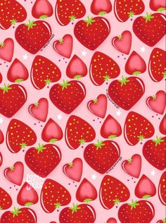 a pink background with lots of red strawberries