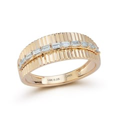 an 18k gold ring with baguettes set in the middle and two rows of diamonds on each band