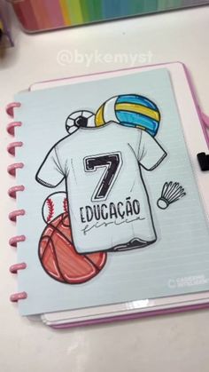 a notebook with an image of a t - shirt and basketball ball on the cover