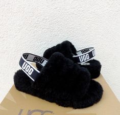 UGG BLACK FLUFF YEAH SLIDE SLIPPERS ~ NEW ( BRAND NEW) WOMEN'S SIZE US 12/ EUR 43/ UK 10  STYLE # 1095119  COLOR: BLACK ~MY ITEMS ARE ALWAYS AUTHENTIC, PLEASE SEE MY TRUSTED FEEDBACK Both indoor and outdoor use Fully covered and lined with sheepskin Stretch UGG logo heel strap Genuine sheepskin UGG logo sock liner ( insole) that naturally wicks away moisture and helps keep your feet dry, warm and cozy 1 1/2" sole with a rubber bottom Please see the pictures for more detail Inside size tag has been marked to prevent retail store returns Please note, most UGGs are now made in China and Vietnam. NONE are made in Australia PLEASE SEE MY OTHER LISTINGS  PLEASE READ: MY ITEMS ARE ALWAYS AUTHENTIC, THIS PAIR HAS THE UGG 2017 HOLOGRAM I BUY ALL MY UGGS FROM THE UGG PARENT COMPANY DECKERS. YES, DEC Ugg Fluff Yeah Slippers, Ugg Fluff Yeah Slides, Black Ugg Slippers, Fluff Yeah Slide, Ugg Scuffette, Uggs Moccasins, Ugg Classic Ultra Mini, Ugg Mini, Shoes Ugg