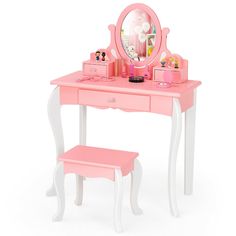 a pink vanity table with a mirror and stool