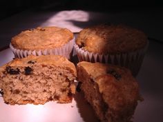 three muffins sitting on top of a white plate