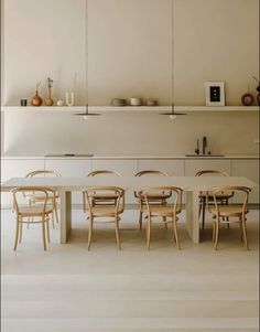 a dining table and chairs in a room