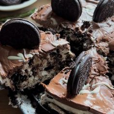 an oreo cookie cake with chocolate frosting and cookies on top, ready to be eaten