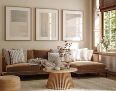 a living room filled with furniture and pictures hanging on the wall above a coffee table