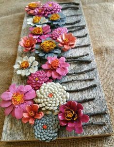 a wooden board with flowers on it