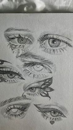 several different types of eyes drawn on paper