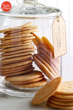 a glass jar filled with cookies and crackers