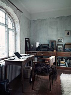 an old fashioned desk in the corner of a room