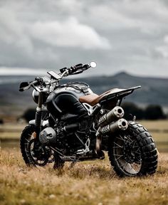 a motorcycle parked in the middle of a field