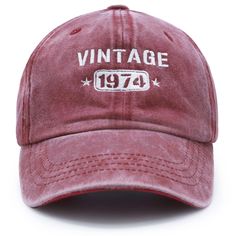 a red hat with the words vintage 1974 printed in white on it's front