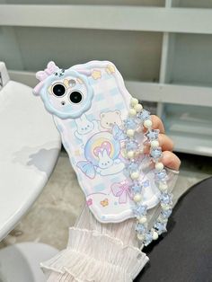 a person holding up a phone case with an animal on it