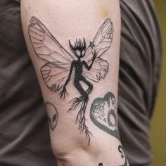 a person with a tattoo on their arm