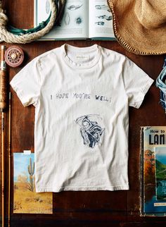 developed in-house from hand-drawn art by matt, and inspired by the thousands of vintage tees we've gotten our hands on over the years. screen printed here in nashville. unisex sizing, this tee runs true to size we recommend that women size down made in the USA 100% cotton garment-washed and preshrunk sewn from our 6oz Cotton T-shirt With Custom Artwork In Relaxed Fit, Cotton T-shirt With Custom Artwork And Relaxed Fit, Relaxed Fit Cotton Tops With Custom Artwork, Graphic Tee Cotton T-shirt With Custom Artwork, Vintage Hand-printed Relaxed Fit Top, Vintage Cotton T-shirt With Custom Artwork, Graphic Tee With Custom Artwork And Relaxed Fit, Relaxed Fit Graphic Tee With Custom Artwork, Vintage Hand-printed Short Sleeve T-shirt