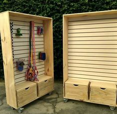 two wooden storage cabinets sitting next to each other