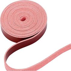 a roll of pink cloth tape on a white background