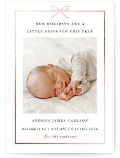 a birth announcement with a baby sleeping on it