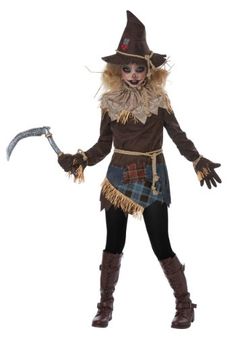 a woman dressed as a scarecrow holding a knife