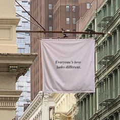 there is a sign that says everyone's love looks different on the side of buildings