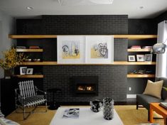 a living room filled with furniture and a flat screen tv mounted on the wall above a fire place