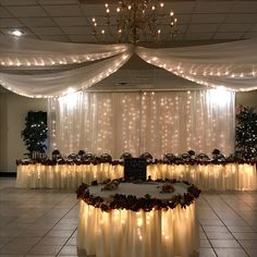 a banquet table with lights and decorations on it