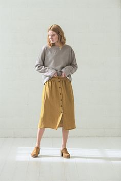 "DETAILS * High waisted linen skirt * Two side pockets * Feel comfortable with elastic band at the back * Natural coconut buttons at the front * Made from soft wash heavy weight (260 gsm) 100 % European linen fabric * Height of the model is 177 cm (5' 8\") and she is wearing size XS/S in heavy honey gold color * Available in 3 colors. Please choose another color and size on the right * Product number: SK03 CARE LABEL * machine wash gentle (40 C/104 F) * dry gentle on low heat * wrinkles give the Clothing Layering, Clogs Outfits, Oversize Blouse, Label Machine, Linen Jumpsuit, Oversized Blouse, Summer Linen, Lovely Clothes, Linen Skirt