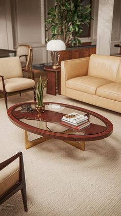 a living room with couches, chairs and a coffee table in front of a potted plant