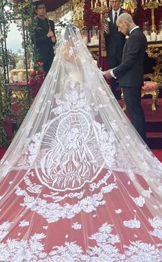 the bride and groom are getting ready to walk down the aisle