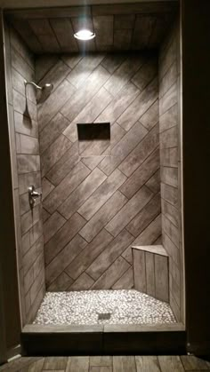 a walk in shower sitting inside of a bathroom