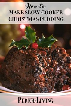 a christmas pudding on a plate with holly - leaf decorations and the words how to make slow - cooker christmas pudding