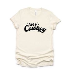 This trendy Bella Canvas short sleeve unisex graphic tee from Simply Sage Market is sure to make a great addition to any wardrobe. We recommend ordering your regular t-shirt size. Please see the size chart. Short Sleeve White Short Sleeve T-shirt For Rodeo, Cheap Western Style Short Sleeve T-shirt, Country Hat, White Screen Print T-shirt For Rodeo, Short Sleeve Graphic T-shirt For Rodeo, Western Style Short-sleeved Screen Print T-shirt, Country Hats, Tractor Supply, Shirt Outfit