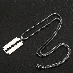 The First 5 Pics Are Stock The Actual Razor Blade Necklace You Will Recive... Add Some Edge To Your Style With This Silver-Colored Razor Blade Pendant Necklace. The Pendant Is Designed In The Shape Of A Razor Blade, With A Chain Necklace Measuring Approximately 23.62 Inches In Length. The Necklace Is Suitable For Both Men And Women. The Pendant's Dimensions Can Be Seen In The Stock Pics & It Has No Stone And A Metal Purity That Is Unknown. The Necklace Is Perfect For Those Who Like To Make A Sta Bagpack Outfit Style, Silver Stainless Steel Punk Necklaces, Emo Silver Necklaces With Adjustable Chain, Grunge Metal Necklaces For Streetwear, Grunge Chains Necklace, Razor Necklace, Blade Necklace, Jewlery Necklace, Accessory Inspo