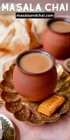 there is a cup of coffee and crackers on the plate