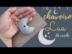 crochet keychain made to look like the moon and stars in the sky