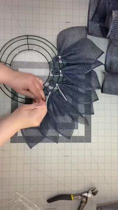 someone is working on something that looks like a flower