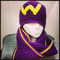 a crocheted hat and scarf with the word wonder written on it in yellow